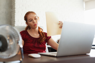 Businesswoman Sweating At Work With Broken Conditioner Businesswoman Sweating At Work With Broken Conditioner