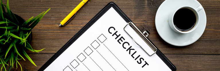 Blank checklist with space for ticks on pad on office desk. Checklist for office worker, manager, businessman, chief on dark wooden background top view